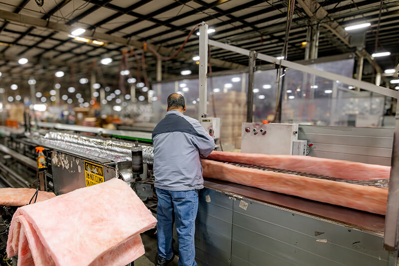 MMF Inc HVAC manufacturing employees collaborating in sheet metal fabrication facility